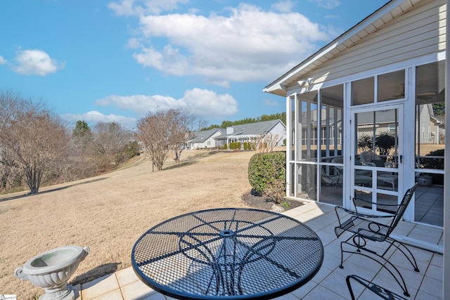 view of patio / terrace with a sunroom