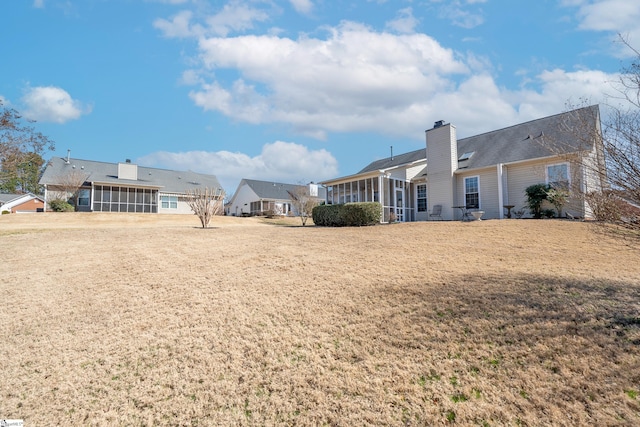 view of yard with a sunroom