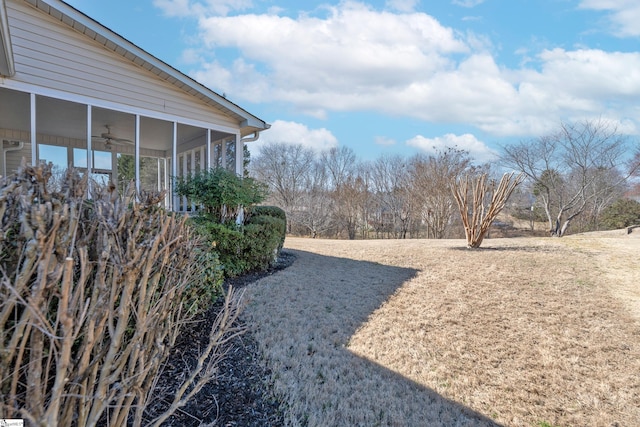 view of yard with a sunroom