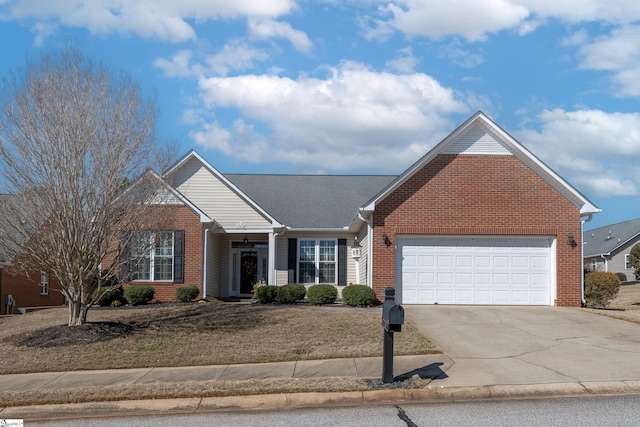 ranch-style home featuring a front yard, brick siding, driveway, and an attached garage