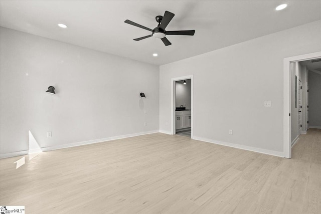 spare room featuring a ceiling fan, recessed lighting, baseboards, and light wood finished floors