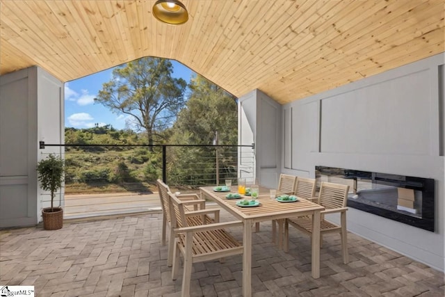 balcony with a patio and outdoor dining area