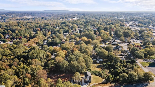 drone / aerial view featuring a forest view