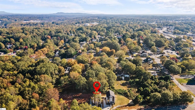 birds eye view of property with a wooded view