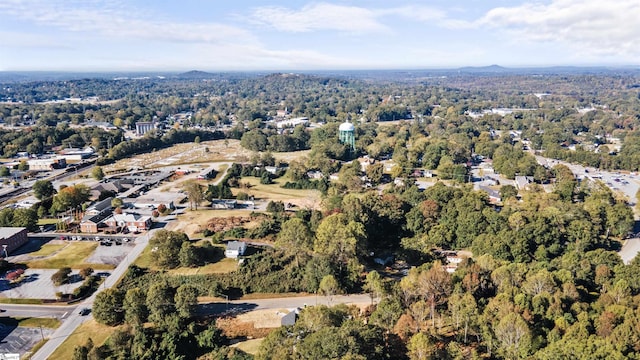 birds eye view of property with a wooded view