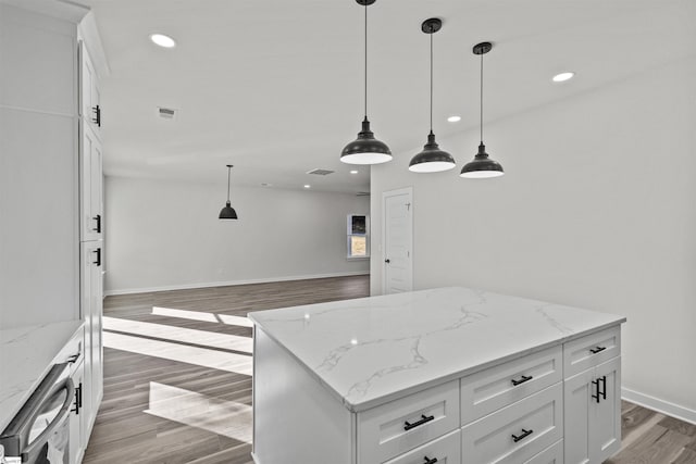 kitchen featuring light wood-type flooring, white cabinets, dishwasher, and recessed lighting