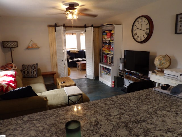 living area with dark wood-style floors and ceiling fan