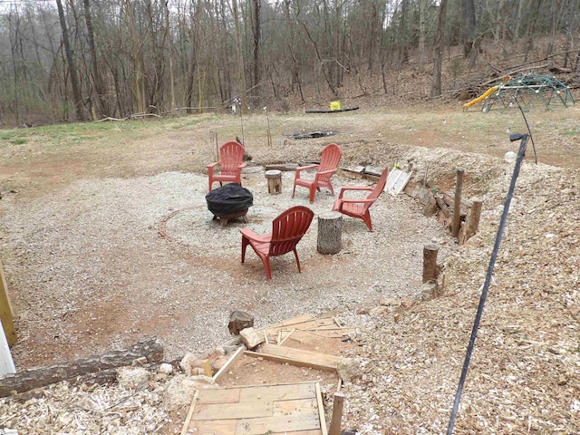 view of yard with an outdoor fire pit