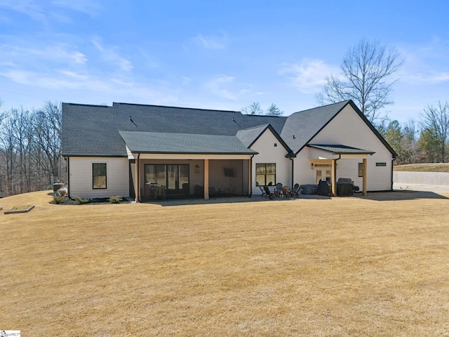 view of front of house featuring a front lawn and a patio