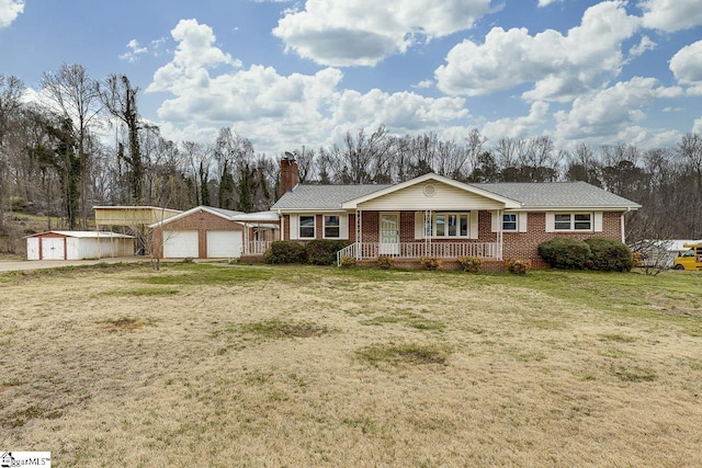 ranch-style house featuring a garage, a chimney, an outbuilding, covered porch, and brick siding