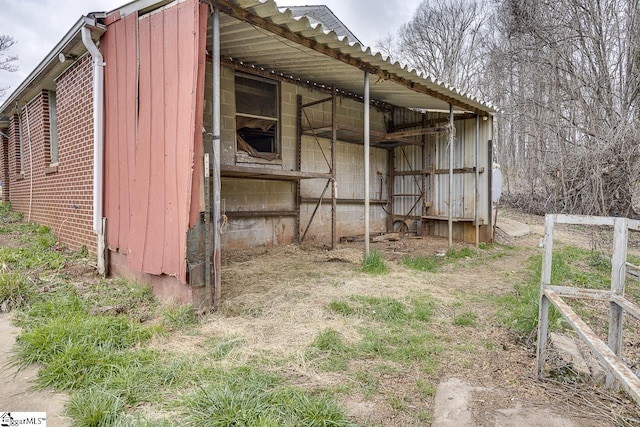 view of side of property with an outbuilding and a pole building