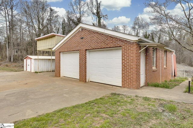 garage featuring driveway