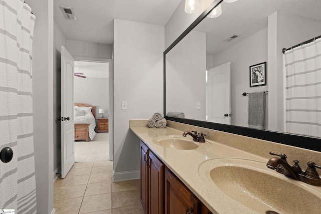 full bathroom with double vanity, a sink, and visible vents