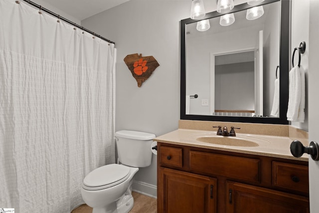 bathroom featuring toilet and vanity