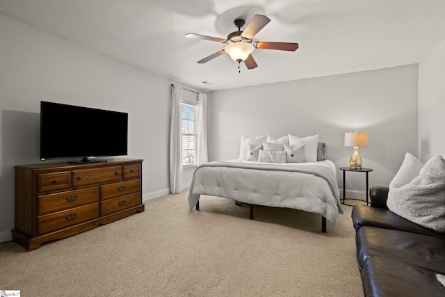 bedroom with light carpet, a ceiling fan, and baseboards