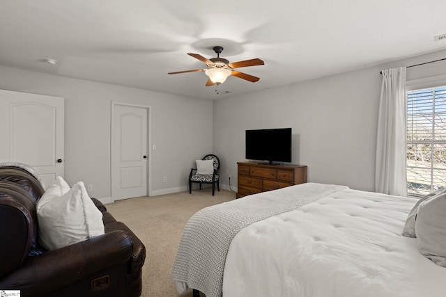 bedroom featuring carpet flooring, ceiling fan, visible vents, and baseboards