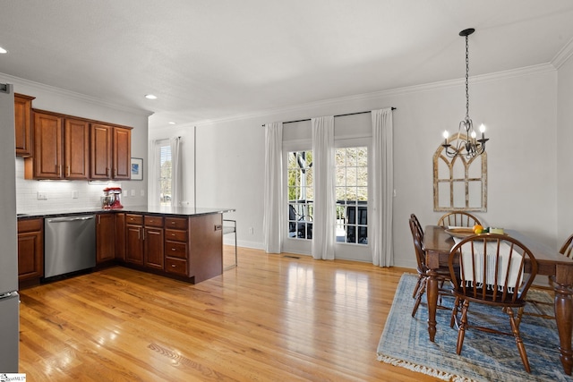 kitchen with a peninsula, light wood-type flooring, dishwasher, brown cabinetry, and crown molding