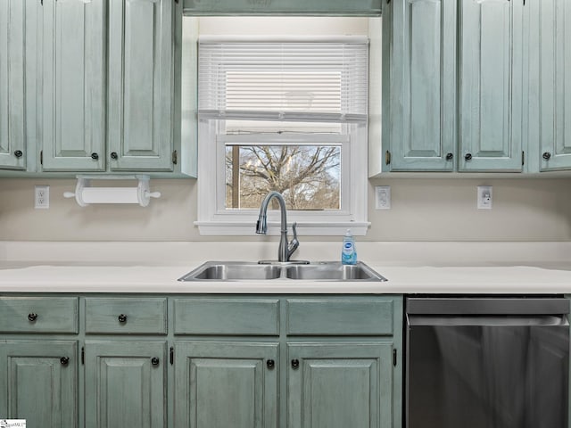 kitchen featuring a sink, light countertops, and dishwasher