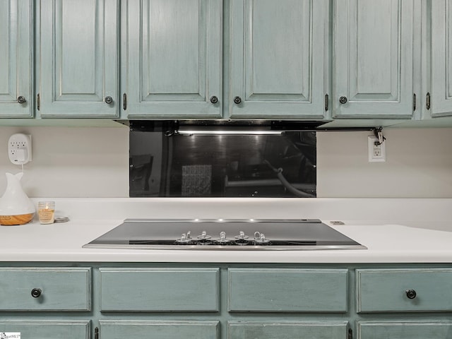 kitchen featuring light countertops and black electric stovetop