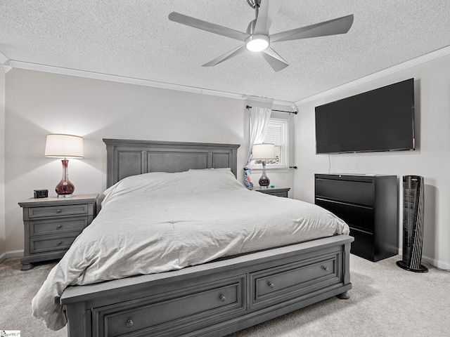 bedroom with ornamental molding, light carpet, a textured ceiling, and a ceiling fan