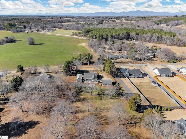 aerial view with a mountain view and a rural view