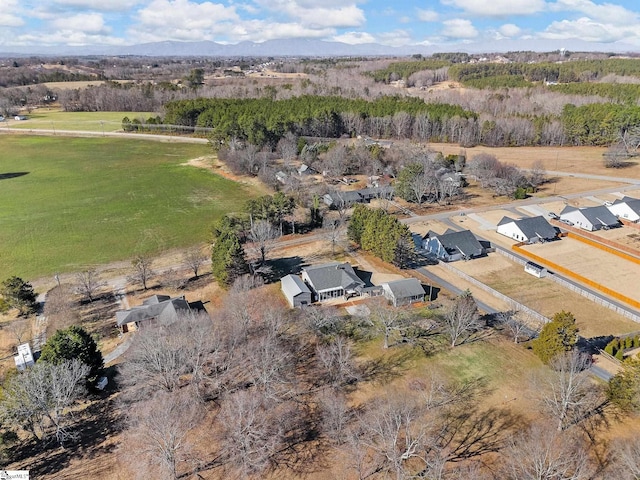 birds eye view of property with a rural view and a mountain view