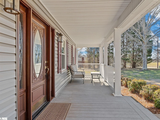 wooden terrace with a porch