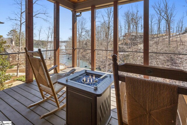 wooden deck with a fire pit