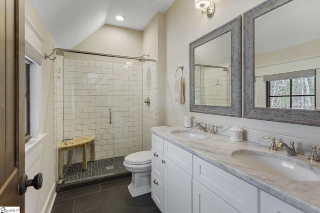 full bathroom featuring tile patterned floors, a sink, toilet, and a shower stall