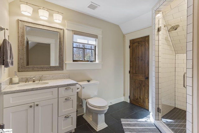 full bath with visible vents, toilet, a stall shower, vanity, and tile patterned floors