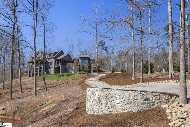 exterior space with driveway and a sunroom