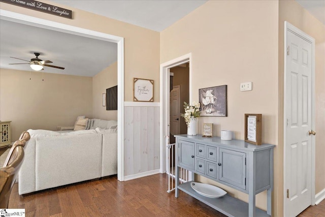 interior space with dark wood-type flooring and ceiling fan