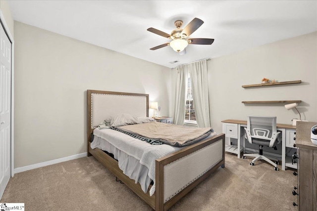 carpeted bedroom featuring ceiling fan and baseboards