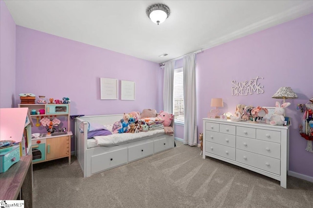 carpeted bedroom with baseboards