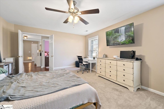 bedroom with carpet floors, baseboards, and a ceiling fan