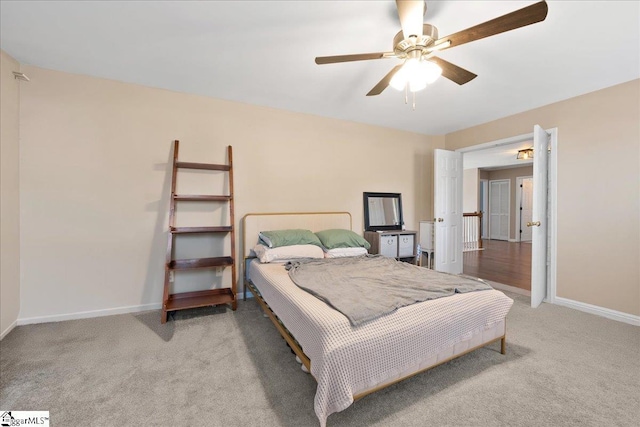 bedroom with carpet floors, a ceiling fan, and baseboards