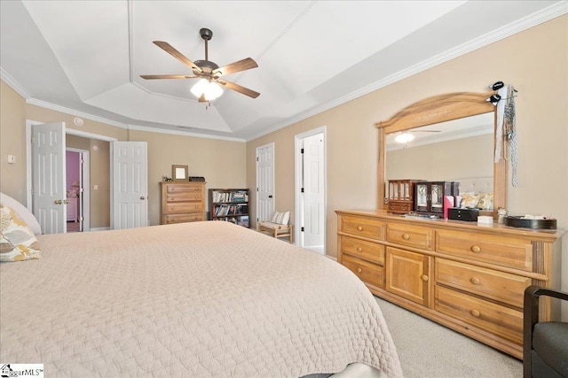 bedroom featuring crown molding, ceiling fan, a tray ceiling, and light colored carpet