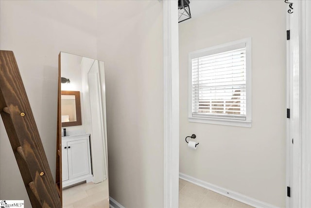 bathroom featuring vanity and baseboards