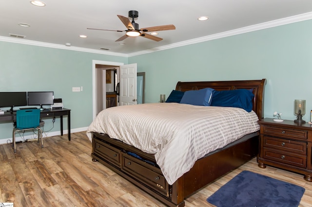 bedroom featuring ornamental molding, baseboards, visible vents, and light wood finished floors