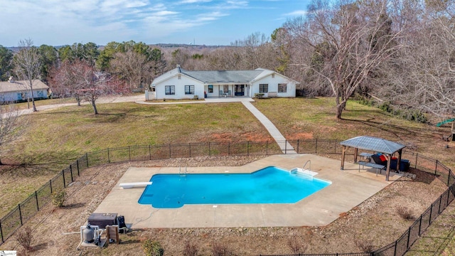 view of swimming pool with a fenced in pool, a lawn, and fence