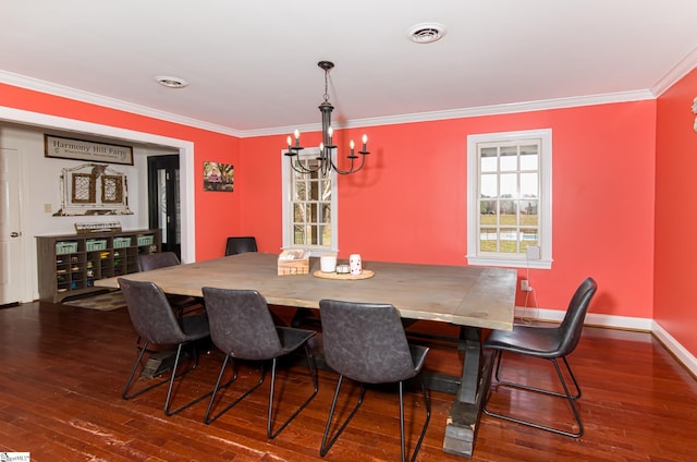 dining space with dark wood-style floors, visible vents, crown molding, and an inviting chandelier