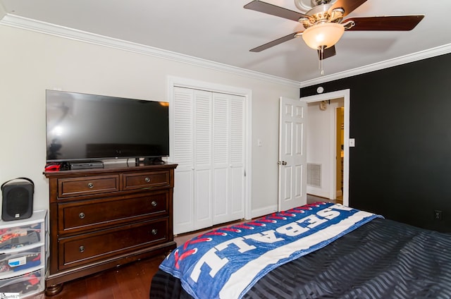 bedroom with ornamental molding, dark wood-style flooring, and visible vents