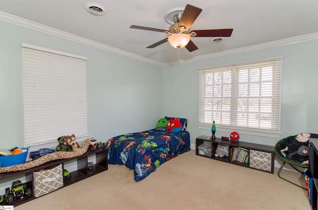 carpeted bedroom featuring visible vents, a ceiling fan, and ornamental molding