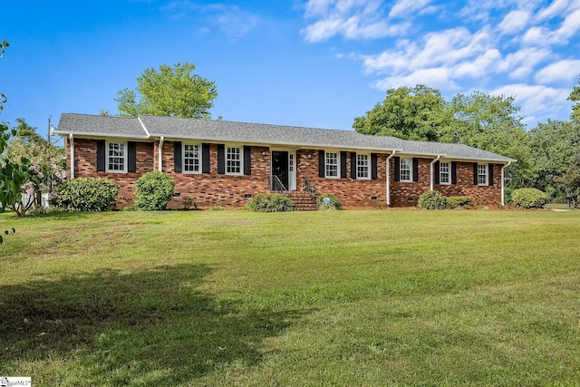 ranch-style house with crawl space, a shingled roof, a front lawn, and brick siding