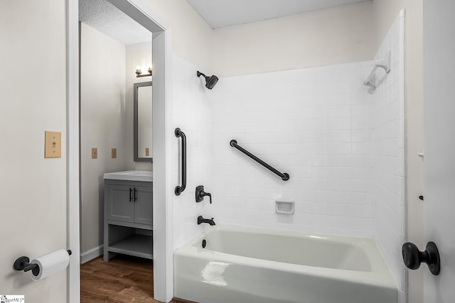 full bathroom featuring shower / bath combination, vanity, and wood finished floors