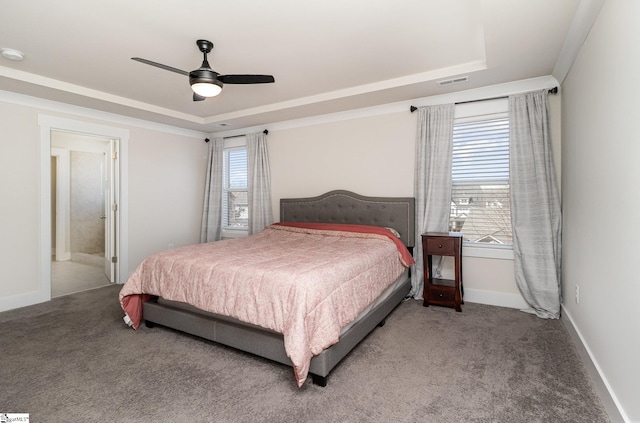 bedroom with visible vents, a raised ceiling, and carpet flooring