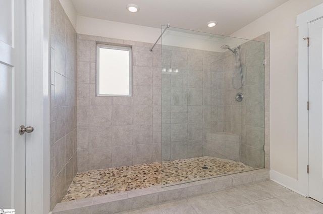 full bath with tiled shower