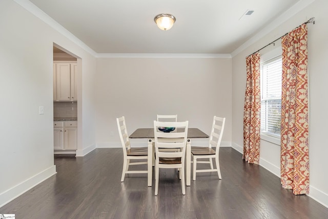 dining space with dark wood-style floors, visible vents, crown molding, and baseboards