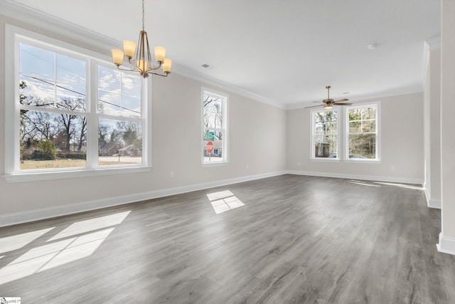 unfurnished dining area with crown molding, visible vents, wood finished floors, baseboards, and ceiling fan with notable chandelier