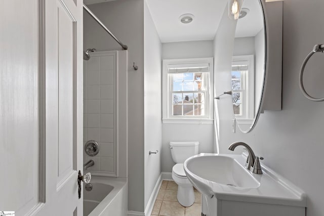 full bath with tile patterned flooring, toilet, vanity, baseboards, and  shower combination